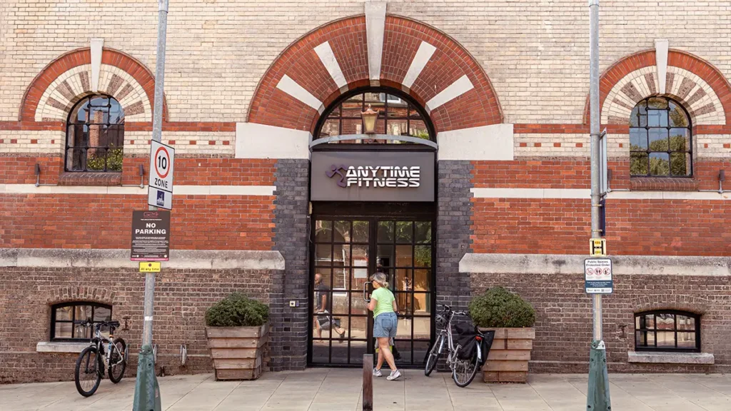 Exterior of Anytime Fitness gym at Brewery Square Dorchester with brick arches and main entrance