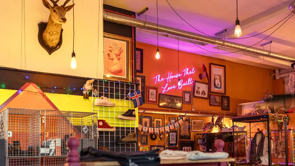 Eclectic interior decor inside Seventh Seal at Brewery Square in Dorchester, with artwork and neon signage